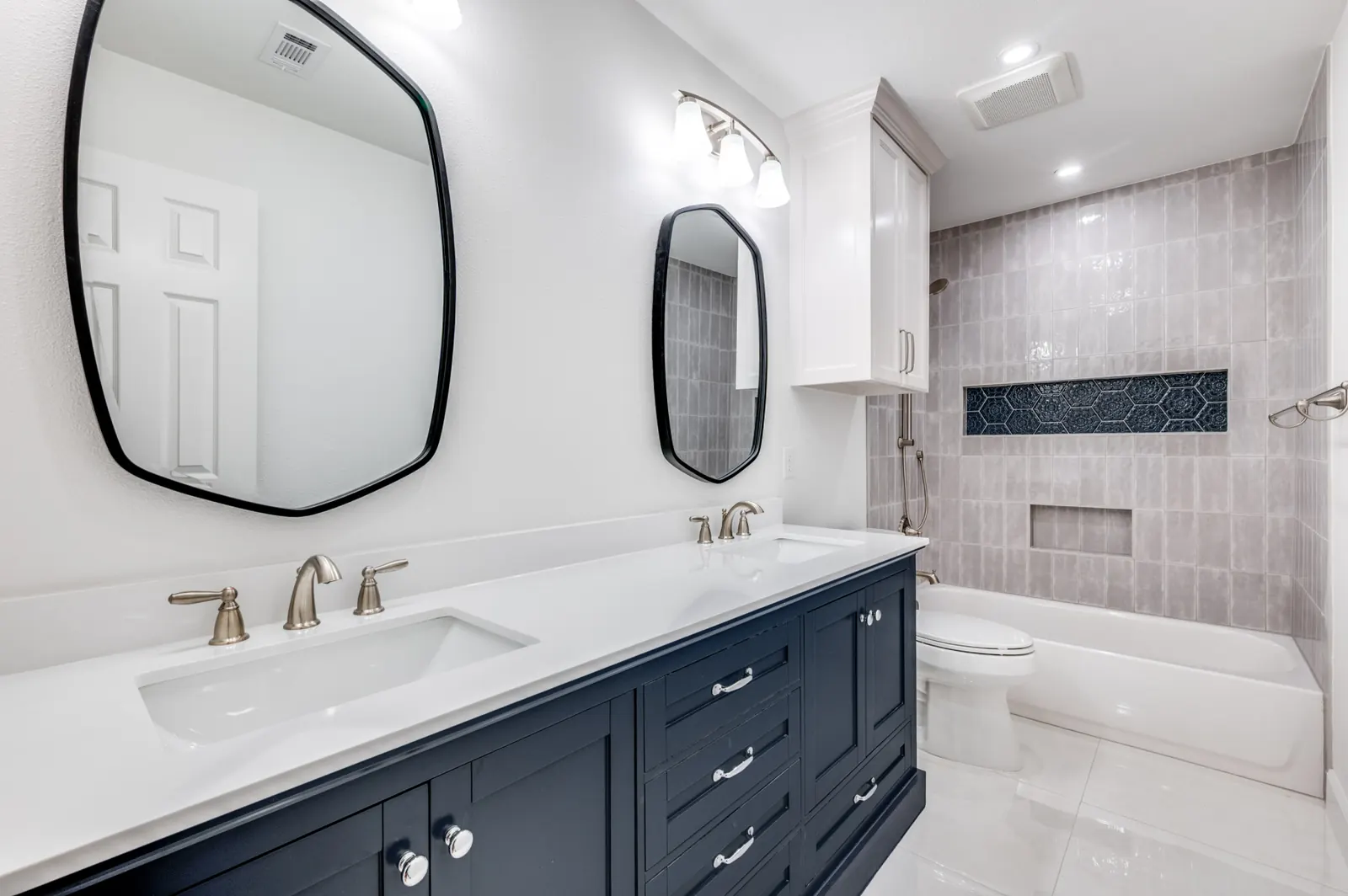 Modern navy vanity bathroom remodel