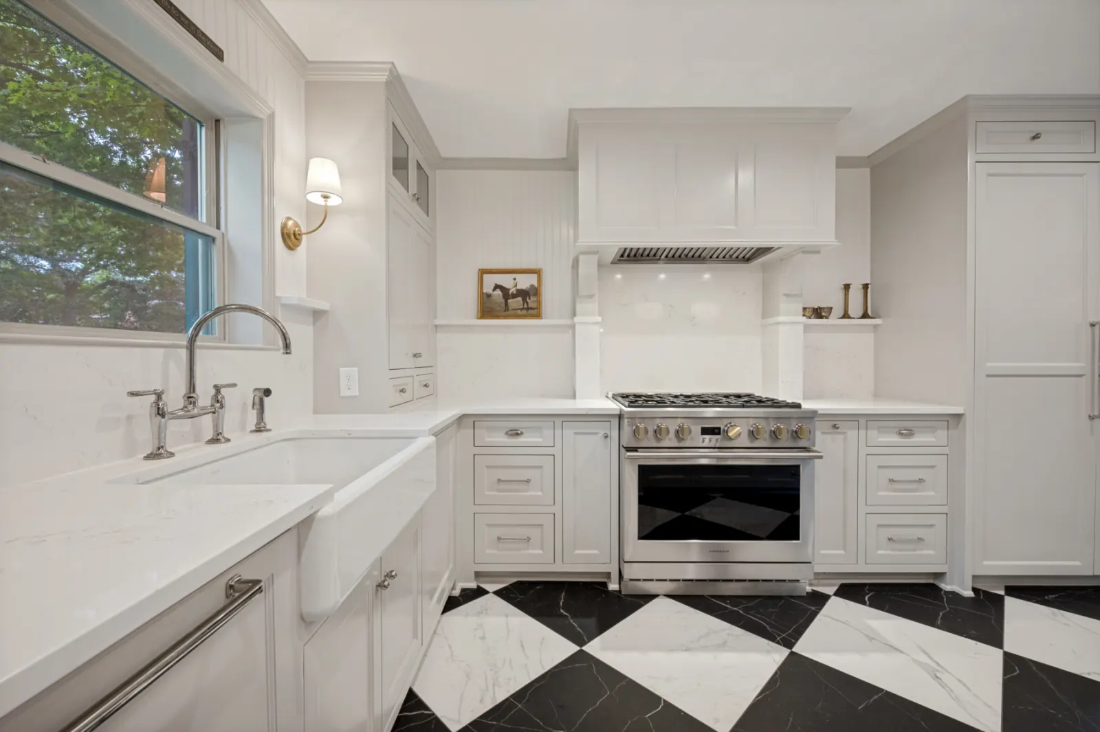 Classic white kitchen with farmhouse sink and marble checkered floor